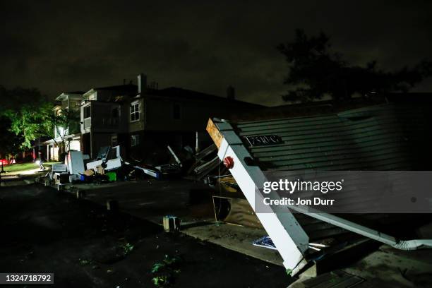 Garage was destroyed on the 7500 block of Gladstone Drive after a tornado came through the area on June 21, 2021 in Naperville, Illinois. Hundreds of...