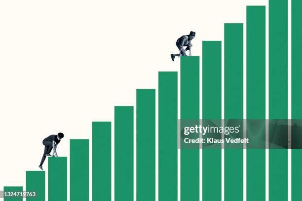 young woman climbing ahead of man on green bar graphs - hazard goal stock pictures, royalty-free photos & images