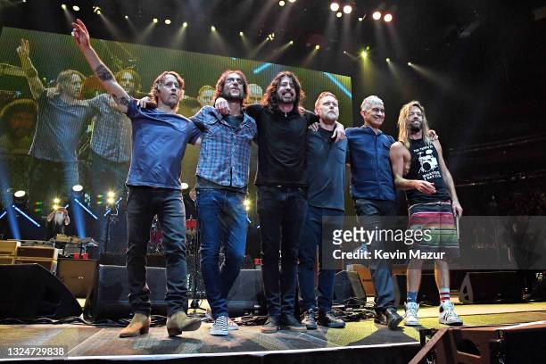 Chris Shiflett, Rami Jaffee, Dave Grohl, Nate Mendel, Pat Smear and Taylor Hawkins pose onstage as The Foo Fighters reopen Madison Square Garden on...