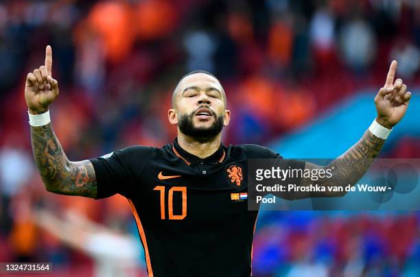 Memphis Depay of Netherlands celebrates after scoring their side's first goal during the UEFA Euro 2020 Championship Group C match between North...