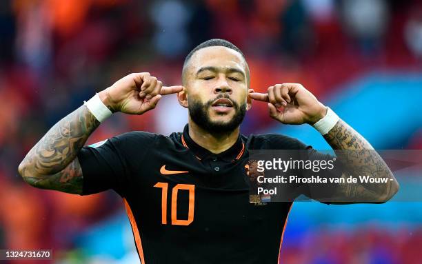 Memphis Depay of Netherlands celebrates after scoring their side's first goal during the UEFA Euro 2020 Championship Group C match between North...
