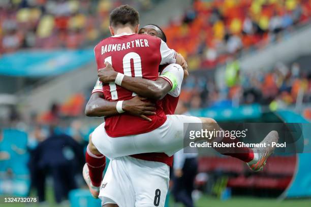 Christoph Baumgartner of Austria celebrates with David Alaba after scoring their side's first goal during the UEFA Euro 2020 Championship Group C...