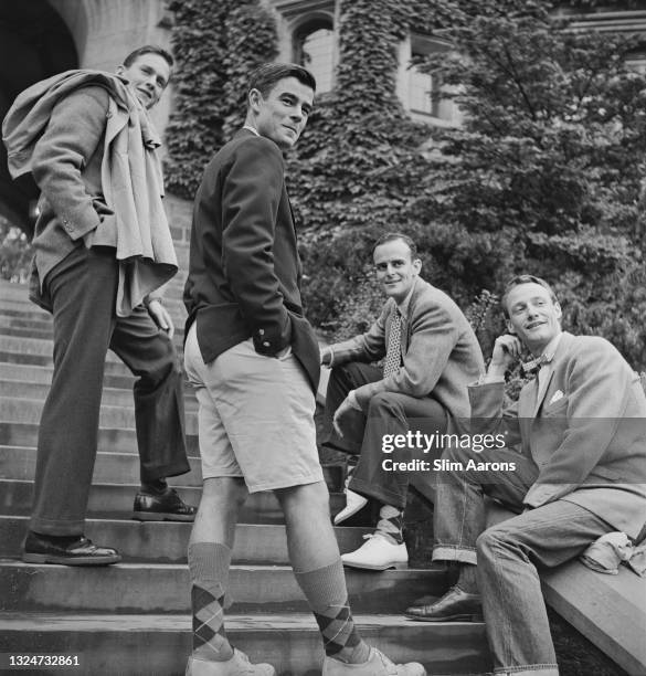 Group of young men in front of Blair Arch at Princeton University, New Jersey, . One young man is wearing jeans.