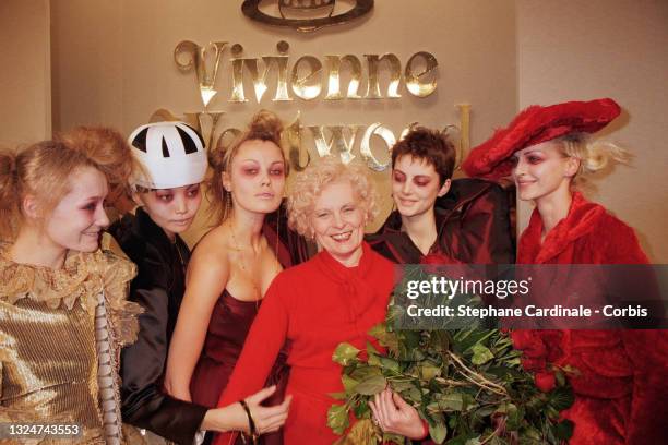 Fashion designer Vivienne Westwood poses with models during the Vivienne Westwood Ready to Wear Fall/Winter 1996/97 show as part of Paris Fashion...