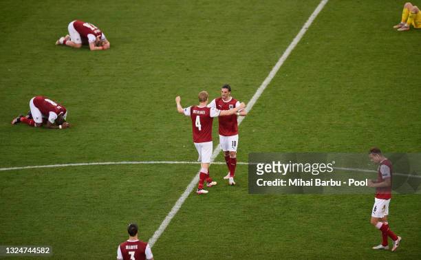 Florian Grillitsch of Austria celebrates their side's victory with team mate Martin Hinteregger after the UEFA Euro 2020 Championship Group C match...