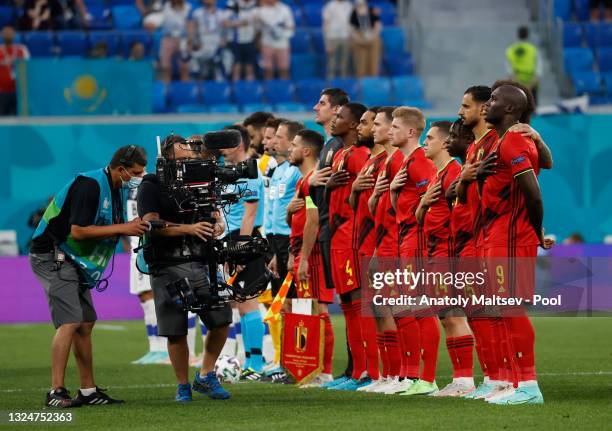 Players of Belgium stand for the national anthem prior to the UEFA Euro 2020 Championship Group B match between Finland and Belgium at Saint...