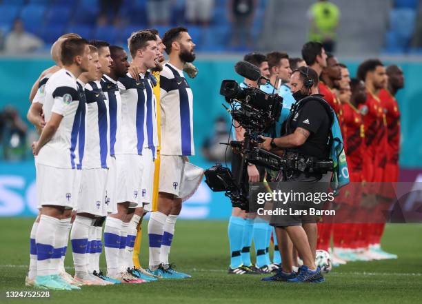 Players of Finland stand for the national anthem prior to the UEFA Euro 2020 Championship Group B match between Finland and Belgium at Saint...