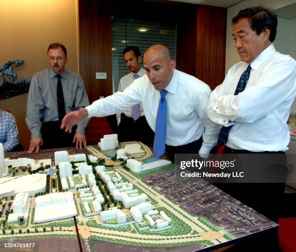 Scott Rechler is shown speaking during an architect design meeting with Charles Wang, . Co-owner of the New York Islanders, on the mixed-use...