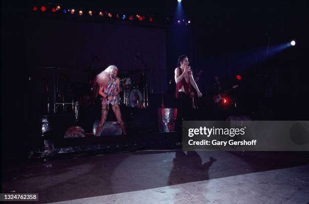 Married American performers dancer Sheryl Goddard and Rock singer Alice Cooper perform onstage during the 'Flush the Fashion' tour at the Palladium,...