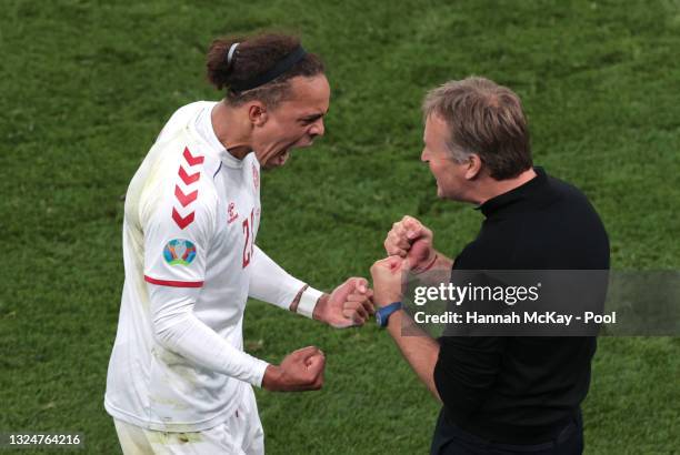 Yussuf Poulsen of Denmark celebrates with Kasper Hjulmand, Head Coach of Denmark after scoring their side's second goal during the UEFA Euro 2020...