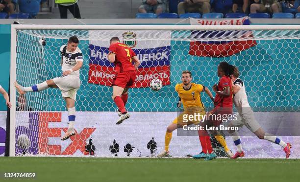Thomas Vermaelen of Belgium headers on target, before Lukas Hradecky of Finland then scores an own goal, Belgium's first goal, as he fails to make a...