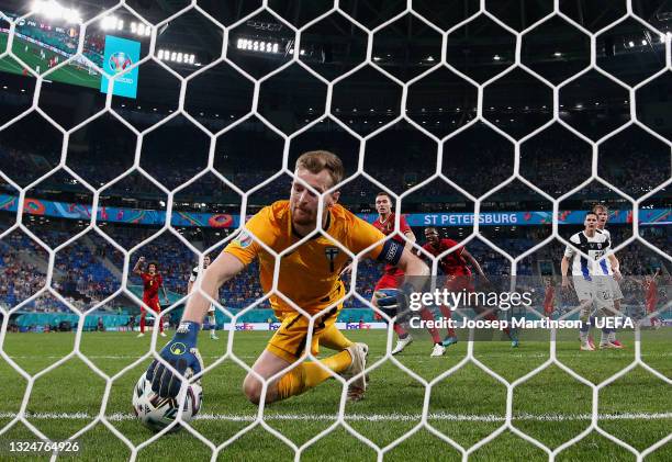 Lukas Hradecky of Finland scores an own goal, Belgium's first goal, as he attempts to save from Thomas Vermaelen of Belgium during the UEFA Euro 2020...