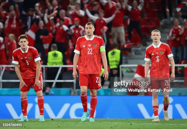 Igor Diveev, Artem Dzyuba and Maksim Mukhin of Russia look dejected after the Denmark fourth goal scored by Joakim Maehle during the UEFA Euro 2020...