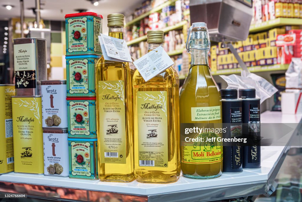 Spain, Barcelona, gourmet olive and truffle oils on display at market stand