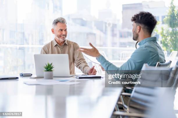 businessmen meeting with digital tablet and laptop computer. - business consultant male stock pictures, royalty-free photos & images