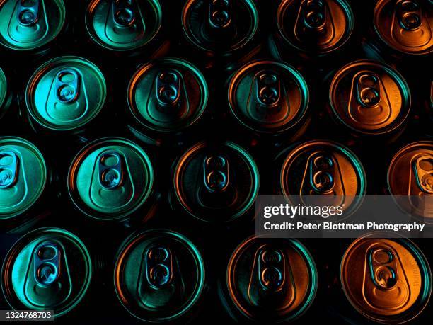 abstract image of light painted aluminum beer can tops - konserverad bildbanksfoton och bilder