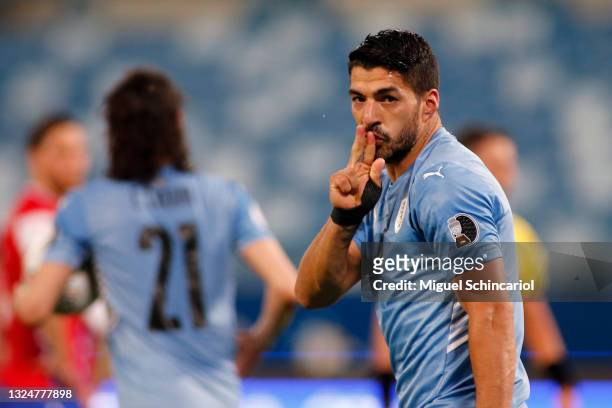 Luis Suarez of Uruguay celebrates after his team first goal scored by an own goal of Arturo Vidal of Chile during a group A match between Uruguay and...