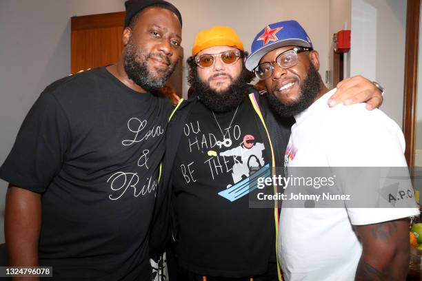 Robert Glasper, Mohammed "Mo" Amer, and Talib Kweli pose backstage during Robert Glasper In Concert at Blue Note Jazz Club on June 20, 2021 in New...