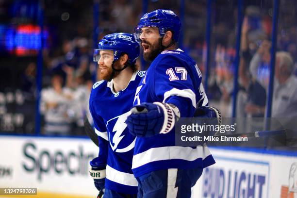 Alex Killorn of the Tampa Bay Lightning is congratulated by Brayden Point after scoring a goal against the New York Islanders during the second...