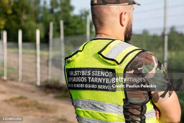 Lithuania State Border guard Vytautas Makauskas patrols near the Lithuania-Belarus border line on June 21, 2021 near Poskonys, Lithuania. The...