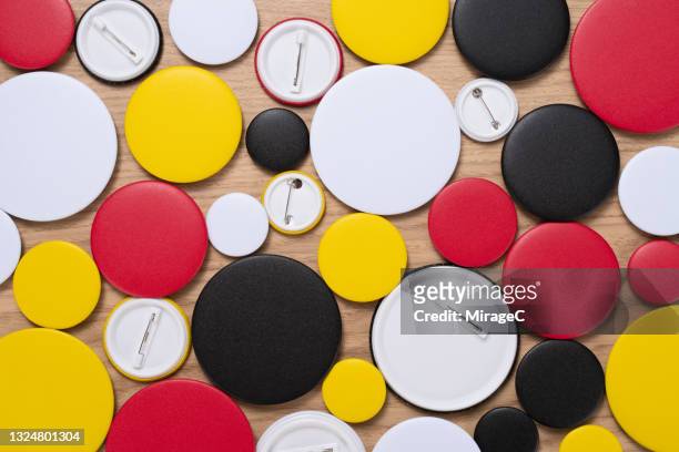 multi colored circle badges - brooch pin stock pictures, royalty-free photos & images