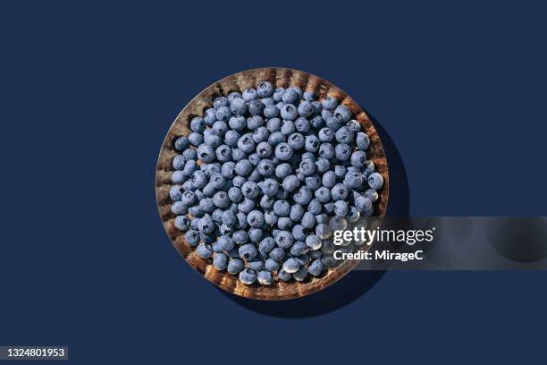 blueberries in a copper tray - blueberry stockfoto's en -beelden