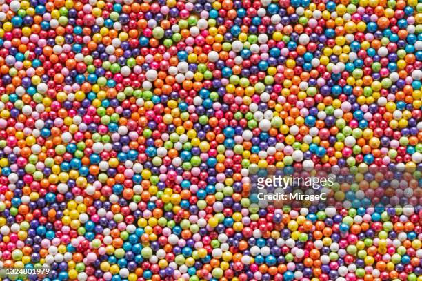 colorful sugar sprinkles topping - bead foto e immagini stock