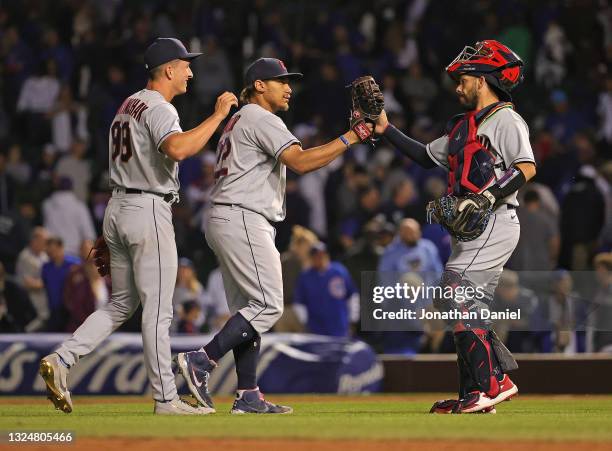 James Karinchak, Josh Naylor and Rene Rivera of the Cleveland Indians celebrate a win against the Chicago Cubs at Wrigley Field on June 21, 2021 in...