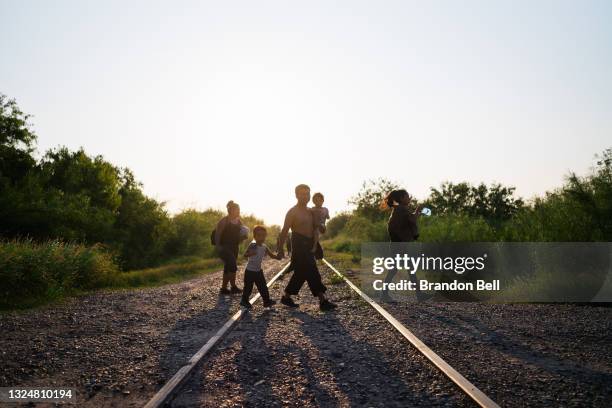 Immigrants walk towards border patrol after crossing the Rio Grande into the U.S. On June 21, 2021 in La Joya, Texas. A surge of mostly Central...