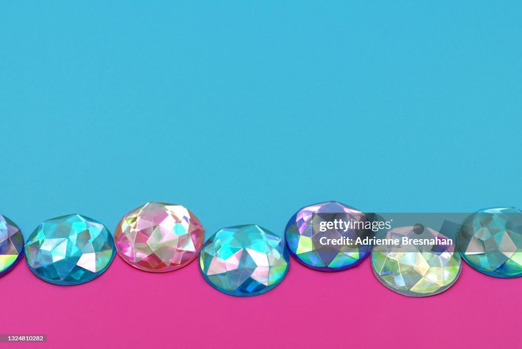 Pastel Colored Rhinestones on Pink and Blue Background