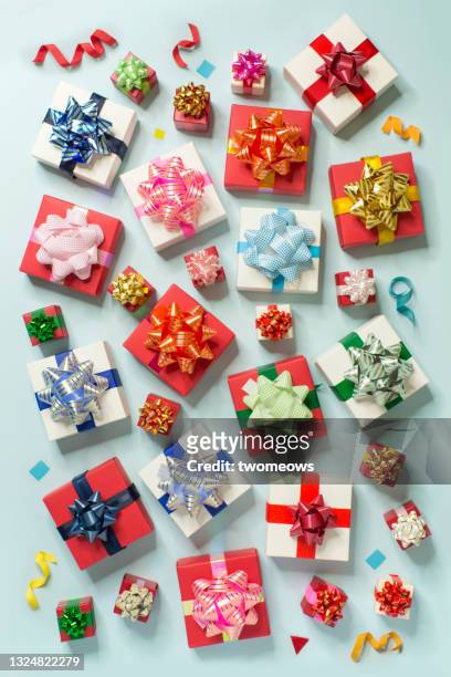 colourful gift boxes on light blue background pattern. - gift ストックフォトと画像