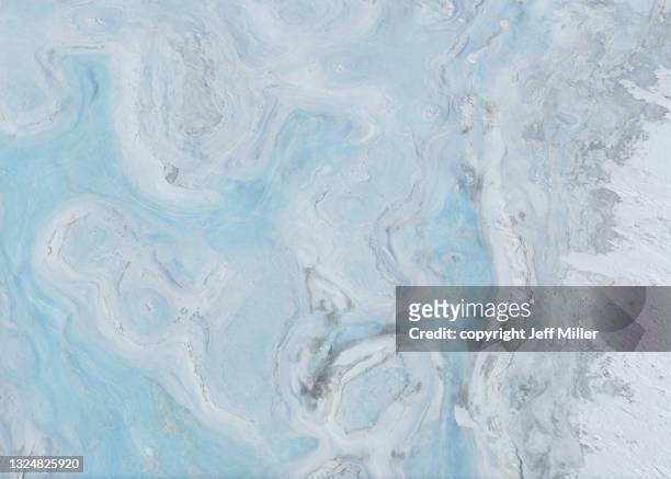 blue melt water pools on sea ice - antartica stock-fotos und bilder