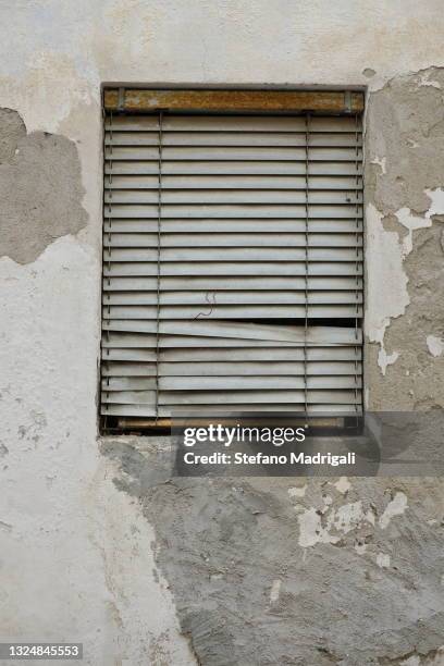 window with broken curtain in concrete wall - curtain wall facade stock pictures, royalty-free photos & images