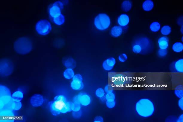 blue sparkling sequins on a dark isolated background. - the beat the chic party stock pictures, royalty-free photos & images