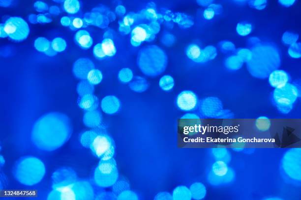 blue sparkling sequins on a blue background. - royal blue background - fotografias e filmes do acervo