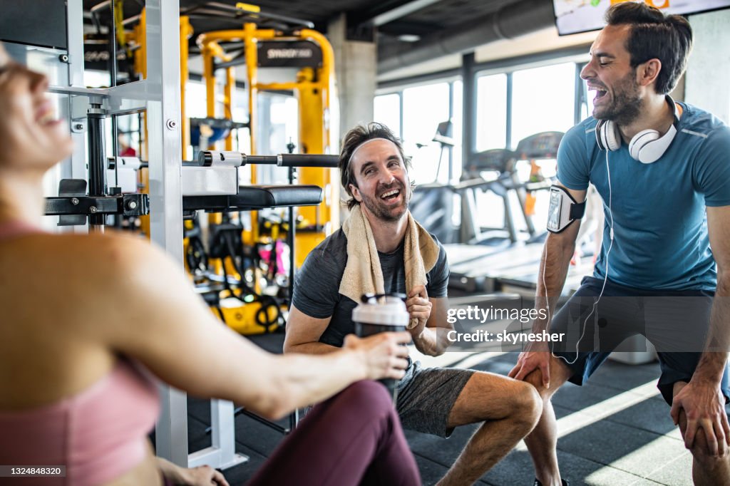 Group Of Happy Athletic Friends Talking On A Break In A Gym High-Res ...