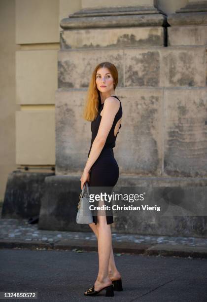 Lisa Banholzer is seen wearing black dress Elaine Hersby, bag Dior, black mules Gucci on June 21, 2021 in Berlin, Germany.