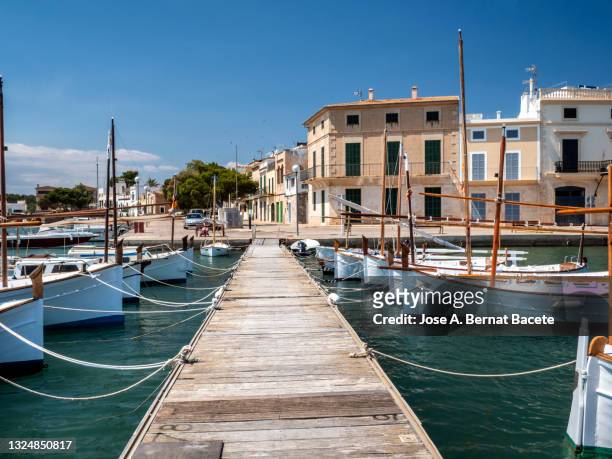 view of the town and marina of portocolom on the majorca island. - palma de mallorca bildbanksfoton och bilder