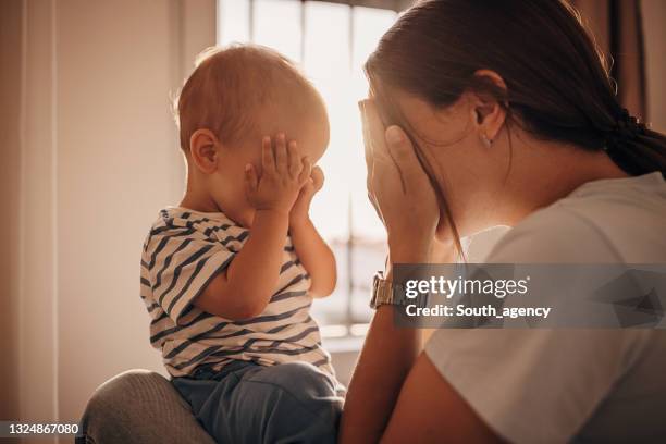 mother and son playing - hands covering eyes stock pictures, royalty-free photos & images