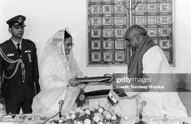 Prime Minister of India H D Deve Gowda with his Bangladesh counterpart Sheikh Hasina sign an agreement for sharing river Ganga water treaty in New...