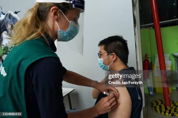 Longgang Liu from Durham receives the Pfizer-BioNTech COVID-19 Vaccine at a new ‘Pop Up’ vaccination service on June 22, 2021 in Newcastle upon Tyne,...