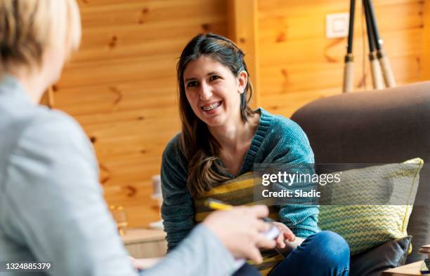 a young woman in a session with a psychologist - cochlear implant stock pictures, royalty-free photos & images