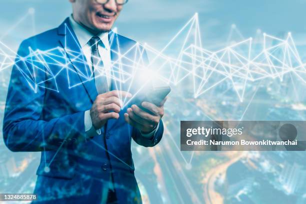 the businessman point to digital hologram on smartphone, the concept of dugital transformation, internet of things and technology - with new era stock pictures, royalty-free photos & images
