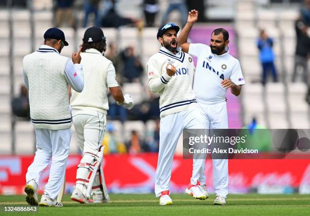 Mohammed Shami of India celebrates the wicket of Colin De Grandhomme of New Zealand with Virat Kohli during Day 5 of the ICC World Test Championship...