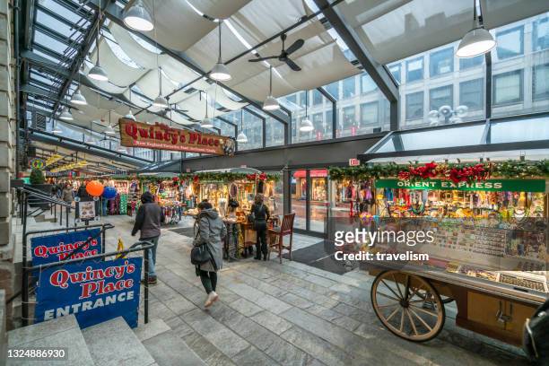 quincy market in faneuil hall marketplace, boston, massachusetts. - boston fern stock-fotos und bilder