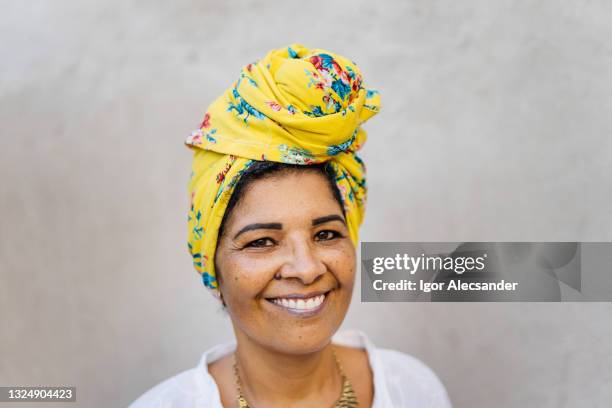 woman wearing yellow turban - brazilian headdress stock pictures, royalty-free photos & images