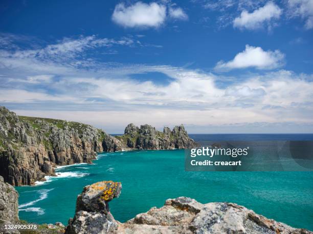 scenic views across pedn vounder beach, south cornwall at high tide on a sunny june day. - lands end cornwall stock pictures, royalty-free photos & images