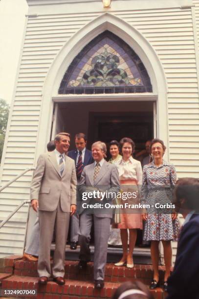 Joan Mondale, Walter Mondale, Jimmy Carter, and Rosalynn Carter leaving services at Carter"u2019s Plains Baptist church, in his hometown of Plains,...