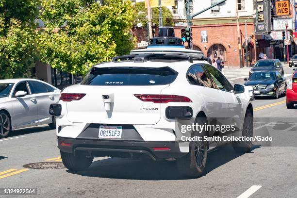 Self-driving car from Waymo and Jaguar, I-Pace, driving in traffic in San Francisco, California, June 14, 2021.