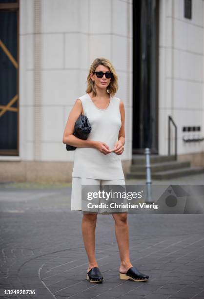 Victoria Scheu is seen wearing knit shorts and top - COS. Clogs - Zara. Bag - Bottega Veneta on June 22, 2021 in Berlin, Germany.